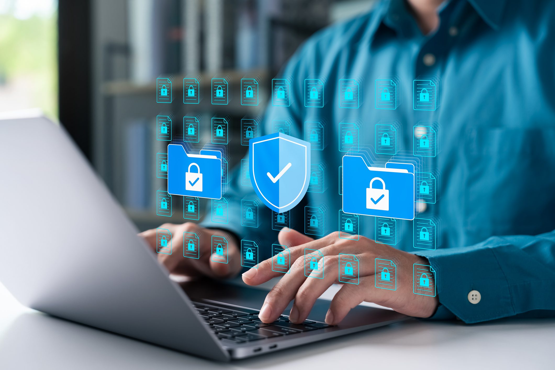 Person typing on secure laptop